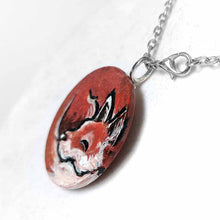 Load image into Gallery viewer, a small wood circle, hand painted with art of a red fox, curled up, sleeping. this piece is available as a keepsake or pendant necklace
