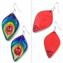 Load image into Gallery viewer, large, leaf shaped, wood fish hook earrings, hand painted with peacock feathers in rainbow colours: purple on top, red in the center, and red on the back
