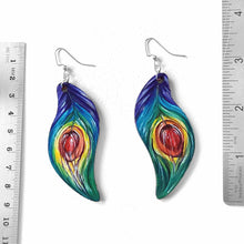 Load image into Gallery viewer, large, leaf shaped, wood fish hook earrings, hand painted with peacock feathers in rainbow colours
