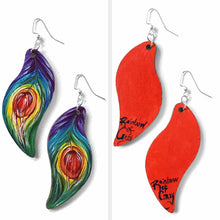 Load image into Gallery viewer, large, leaf shaped, wood fish hook earrings, hand painted with peacock feathers in rainbow colours: purple on top, red in the center, and red on the back
