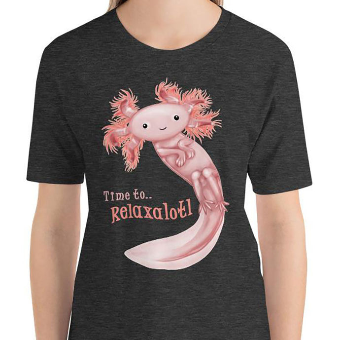 A woman is wearing the Relax Axolotl Unisex Premium T-Shirt in the colour dark grey heather, which includes an image of a smiling pink axolotl, and the words, 
