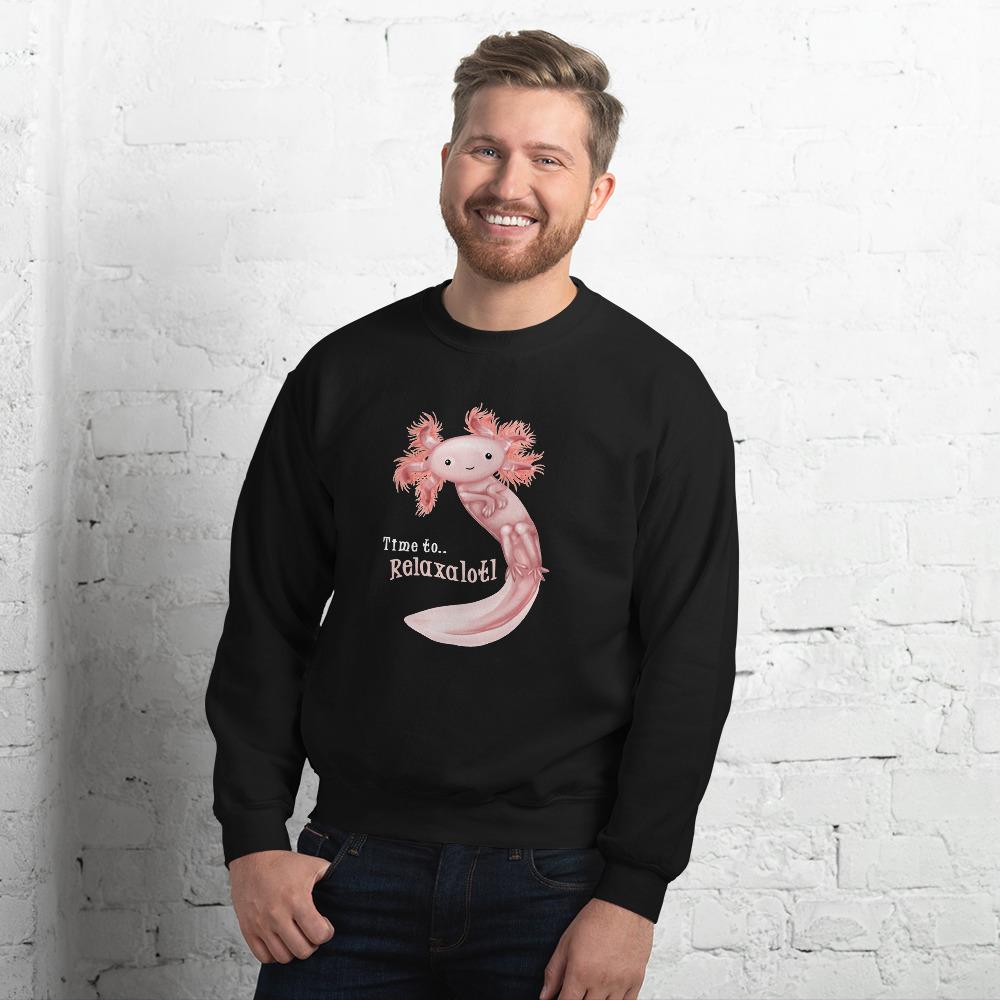 A man is wearing a unisex sweatshirt in the colour black, featuring a print of a pink axolotl, and reads, 