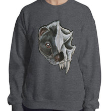 Load image into Gallery viewer, A woman wears a unisex sweatshirt in the colour dark heather grey, printed with a graphic of a split portrait: the left side features the face of a skunk, and the right side features an evil looking skunk skull
