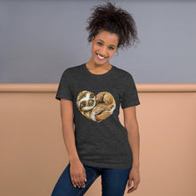 Load image into Gallery viewer, A woman is wearing the Sloth Love Unisex Premium T-Shirt in the colour dark grey heather, which includes a graphic of a sloth forming the shape of a heart.
