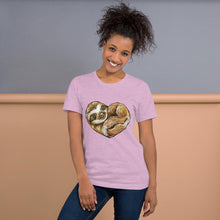 Load image into Gallery viewer, A woman is wearing the Sloth Love Unisex Premium T-Shirt in the colour heather prism lilac, which includes an image of a sloth forming the shape of a heart.
