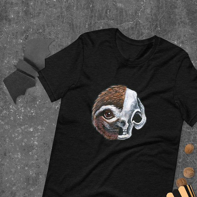 A premium unisex t-shirt in the colour black, features a print of a split image: a skull's face on the left side and a sloth skull on the right.