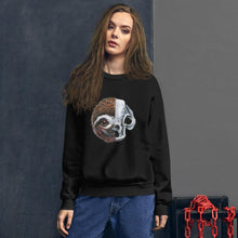 Load image into Gallery viewer, A woman wears a unisex sweatshirt in the colour black, printed with art of a split image: the left side features a sloth&#39;s face, and the right side features an evil looking sloth skull.

