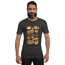 Load image into Gallery viewer, A man is wearing the Sourdough Lovers unisex premium t-shirt in the colour dark grey heather, printed with an illustration of 10 different sourdough breads.
