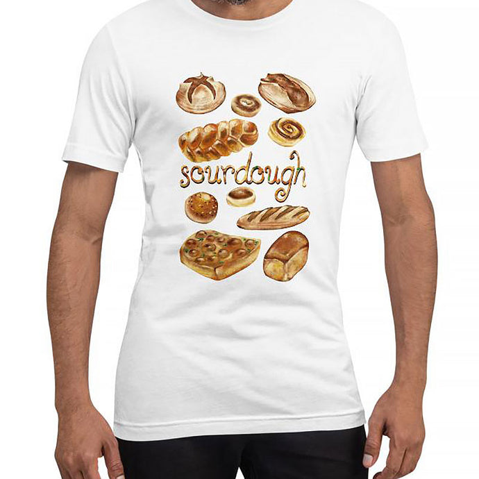 A man is wearing the Sourdough Lovers unisex premium t-shirt in the colour white, printed with art of 10 different sourdough breads.