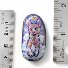 Load image into Gallery viewer, a beach stone, hand painted with a portrait of a sphynx cat as an angel in the clouds. available as a keepsake rock art, or pendnat necklace
