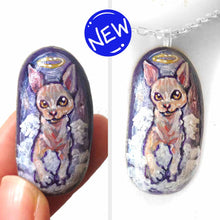 Load image into Gallery viewer, a beach stone, hand painted with a portrait of a sphynx cat as an angel in the clouds. available as a keepsake rock art, or pendnat necklace
