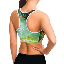 Load image into Gallery viewer, A woman wearing sports bra printed with an illustration of an orb weaver spider in front of its spider web.
