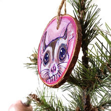 Load image into Gallery viewer, A wood Christmas tree ornament, hand painted with art of a sugar glider in front of a pink background.
