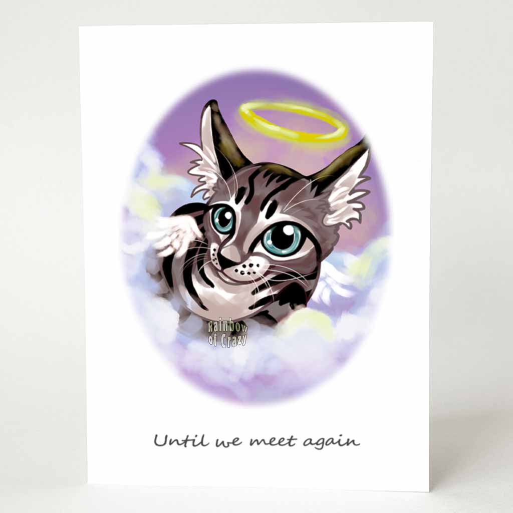 A greeting card with art of a tabby cat with blue gray eyes, angel wings and a halo. it sits on the clouds against a purple and pink sky. The card reads, 