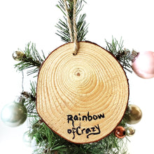 Load image into Gallery viewer, The back of a cat wood ornament, signed with, Rainbow of Crazy
