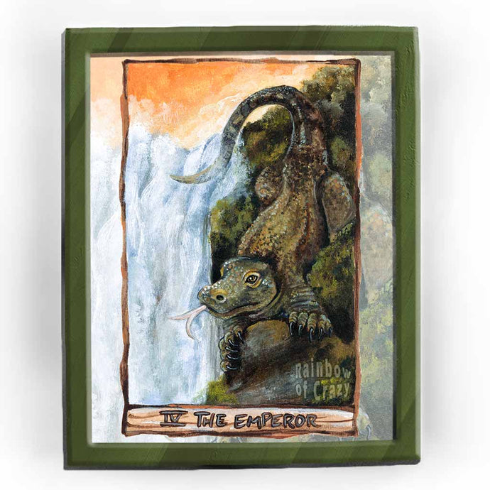 an art print of the emperor tarot card, from the animism tarot: a komodo dragon stands neat the top of a waterfall, looking over the land.