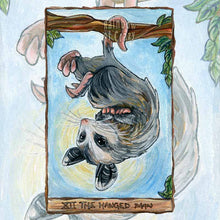 Load image into Gallery viewer, an art print of the hanged man tarot card, from the animism tarot: an opossum hangs upside down from a tree branch.
