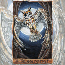 Load image into Gallery viewer, an art print of the high priestess tarot card from the animism tarot: a striped owl, with wings spread, flies in between two trees with the full moon shining behind her.
