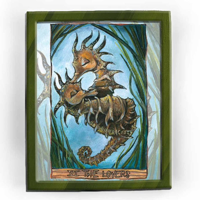 This art print features The Lovers tarot card from the Animism Tarot: two long-snouted seahorses embrace, wrapped around each other, surrounded by seaweed