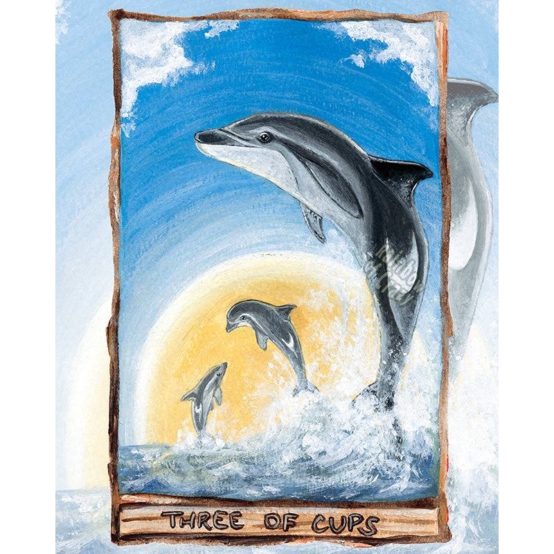 This art print features the Three of Cups tarot card from the Animism Tarot: three dusky dolphins jump out of the ocean, enjoying the warmth of the sun together.