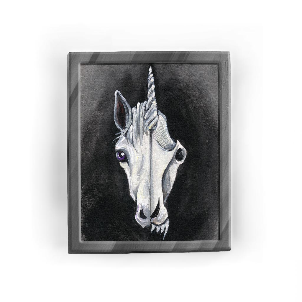 An art print featuring an illustration of a unicorn's face on the left side and its stylized skull on the right side.