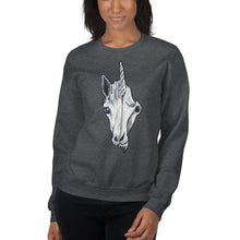 Load image into Gallery viewer, A woman is wearing a unisex sweatshirt in the colour dark heather grey, which is printed with a split image: the left side features the face of a unicorn, and the right side features an evil looking skull
