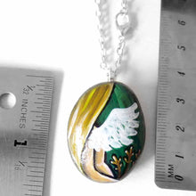 Load image into Gallery viewer, rock art featuring the virgo zodiac sign: a portrait of a woman&#39;s back, with angel wings and long blond hair. three sheaves of wheat lay next to her. available as a keepsake or pendant necklace
