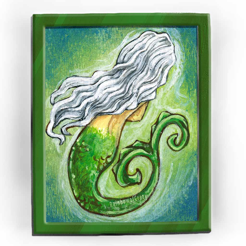 a print featuring art of a mermaid with long white hair, her face hidden away from the viewer.