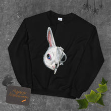 Load image into Gallery viewer, A unisex sweatshirt in the colour black, printed with an image of a split image: the left side features a white bunny rabbit&#39;s face, and the right side features an evil looking rabbit skull
