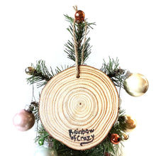 Load image into Gallery viewer, The back of a rat wood ornament, signed with, Rainbow of Crazy
