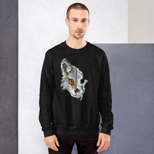Load image into Gallery viewer, A man wears a unisex sweatshirt in the colour black, printed with art of a split image: the left side features a wolf&#39;s face, and the right side features an evil looking wolf skull.
