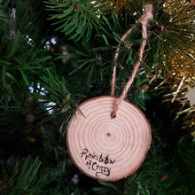 Load image into Gallery viewer, The back of a snake wood ornament, signed with, Rainbow of Crazy
