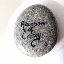 Load image into Gallery viewer, a beach stone, hand painted with the portrait of a black and brown yorkie&#39;s face, signed on the back with, Rainbow of Crazy
