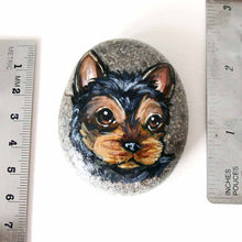 Load image into Gallery viewer, a beach stone, hand painted with the portrait of a black and brown yorkie&#39;s face
